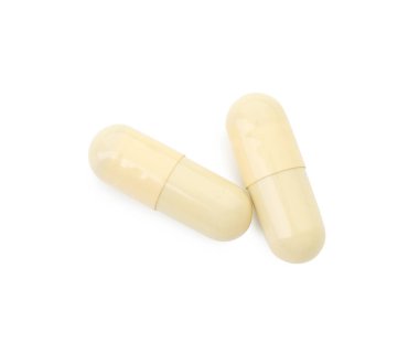 Vitamin kapsülleri beyaz, üst görünümde izole edilmiş. Sağlık takviyesi