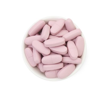 Vitamin hapları beyaz kasede izole edilmiş, üst tarafta. Sağlık takviyesi