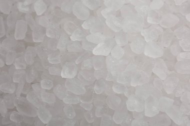 White natural salt as background, top view clipart
