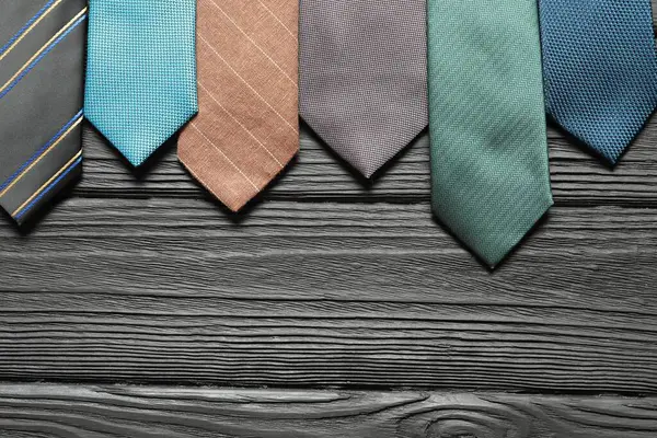 Different Neckties Black Wooden Table Flat Lay Space Text — Stock Photo, Image