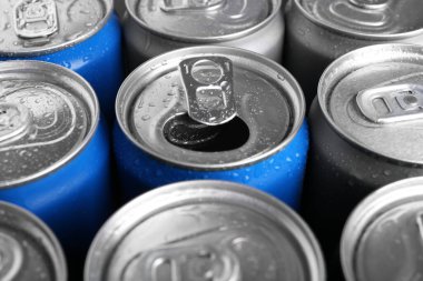 Energy drinks in wet cans as background, closeup. Functional beverage clipart