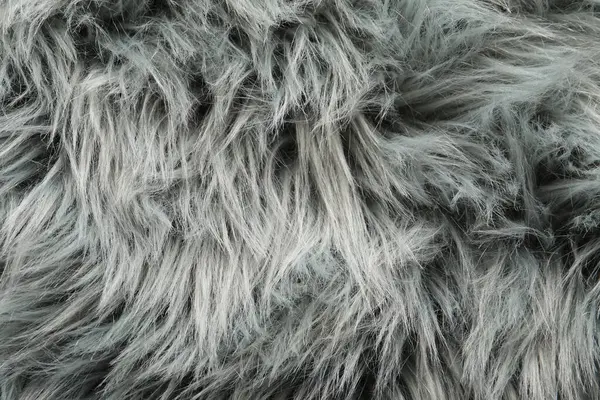 Texture of grey faux fur as background, top view