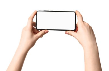 Woman holding smartphone with blank screen on white background, closeup. Mockup for design