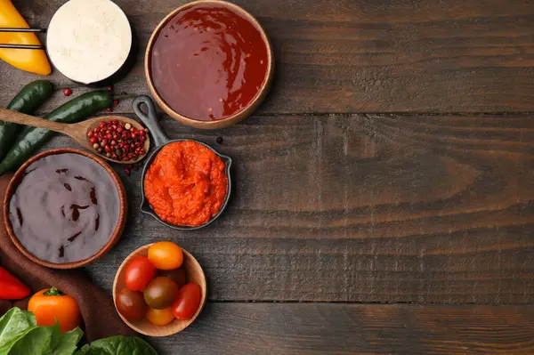 stock image Different marinades and products on wooden table, flat lay. Space for text