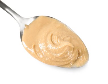 Beyaz kaşık içinde lezzetli fındık ezmesi