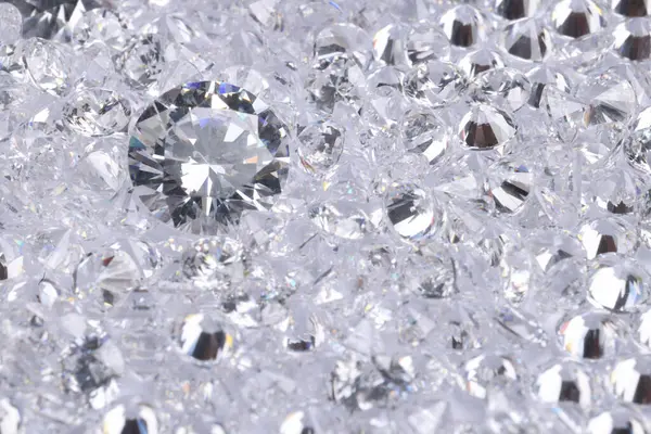 Many beautiful shiny diamonds as background, above view