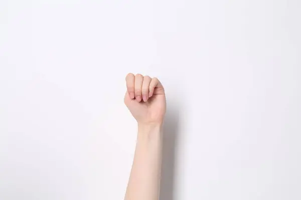 SOS gesture. Woman showing signal for help on white background, closeup