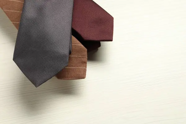 Different Neckties White Wooden Table Top View Space Text — Stock Photo, Image