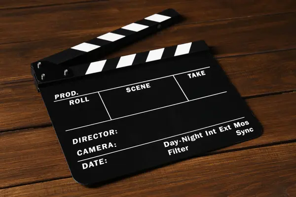 stock image One clapperboard on wooden table, closeup view