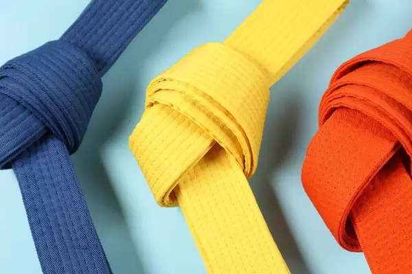 Colorful Karate Belts Light Blue Background Flat Lay — Stock Photo, Image