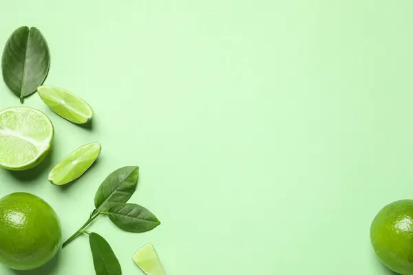 Whole Cut Fresh Ripe Limes Leaves Light Green Background Flat Royalty Free Stock Images