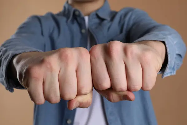 stock image Man showing fists with space for tattoo on beige background, selective focus
