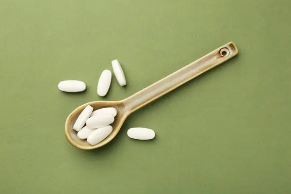 Vitamin Pills Spoon Olive Background Top View Imagens Royalty-Free