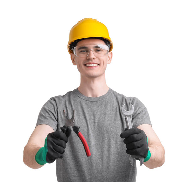 Young man holding pliers on white background