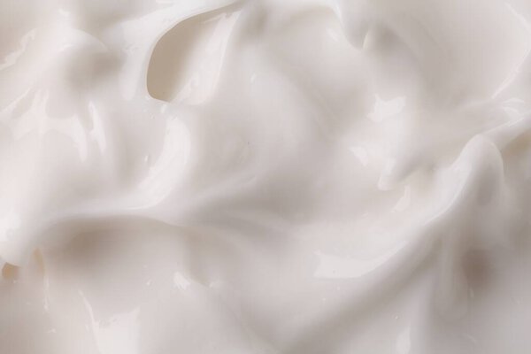 Texture of body care cream as background, top view