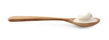 Beyaz kaşık içinde ekşi krema.