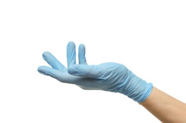 Açık mavi eldivenli doktor beyaz arka planda bir şey tutuyor, yakın plan.