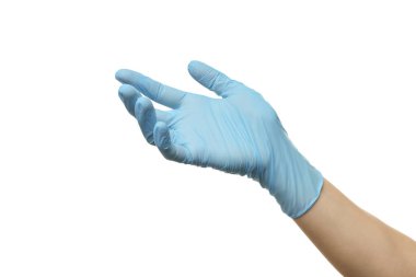 Açık mavi eldivenli doktor beyaz arka planda bir şey tutuyor, yakın plan.