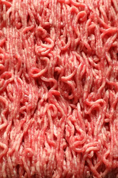 Raw ground meat as background, top view