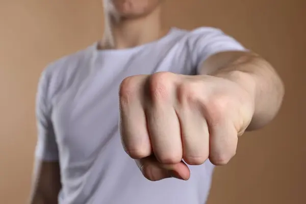 stock image Man showing fist with space for tattoo on beige background, selective focus