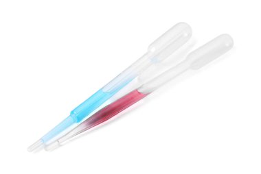 Beyaz üzerine sıvı yalıtılmış iki pipet.