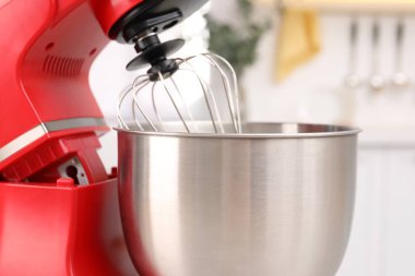 Modern red stand mixer in kitchen, closeup