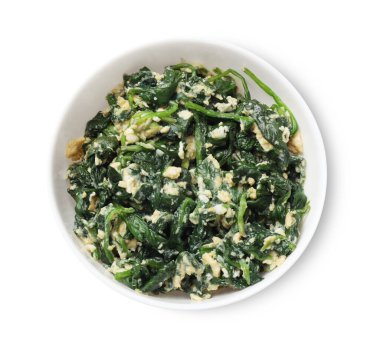 Lezzetli ıspanak dalışı ve beyaz tenceredeki yumurtalar.