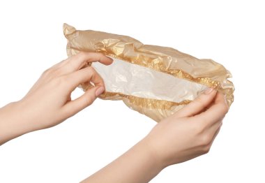 Woman holding one shoe cover on white background, closeup