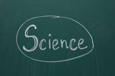 Word Science written with chalk on green board