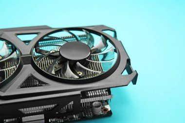 One graphics card on light blue background, closeup