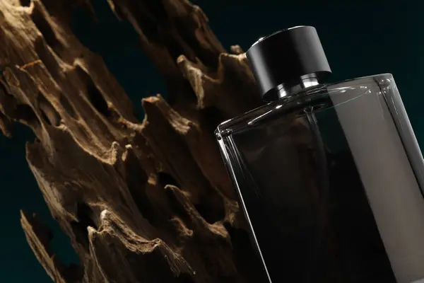 Luxury men`s perfume in bottle on color background, closeup. Space for text
