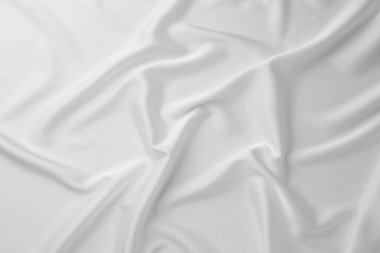 Arkaplan olarak buruşmuş beyaz ipek kumaş dokusu, üst görünüm
