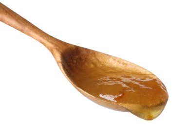 Tatlı reçelli kaşık beyaz üzerine izole