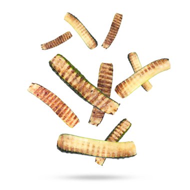 Slices of grilled zucchinis in air on white background clipart
