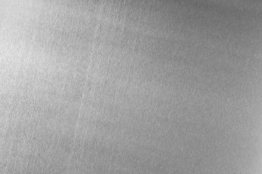 Shiny silver foil as background, top view