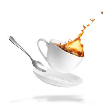 Cup of coffee, saucer and spoon in air on white background