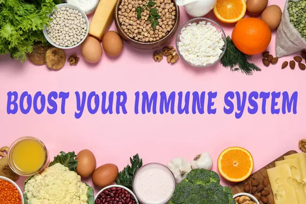 Bağışıklık sistemini uygun bir diyetle güçlendir. Pembe masadaki farklı yiyecekler, düz yatak.