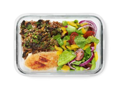 Sağlıklı yemek. Pirzola, karabuğday ve salata kabın içinde, beyaz, üst manzara