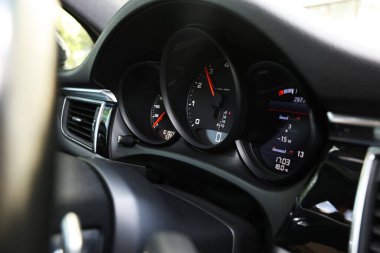 Speedometer and tachometer inside of modern car, closeup