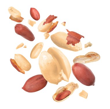 Many peanuts in air on white background