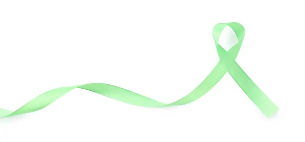 stock image Light green awareness ribbon isolated on white, top view