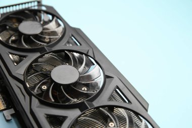 One graphics card on light blue background, closeup