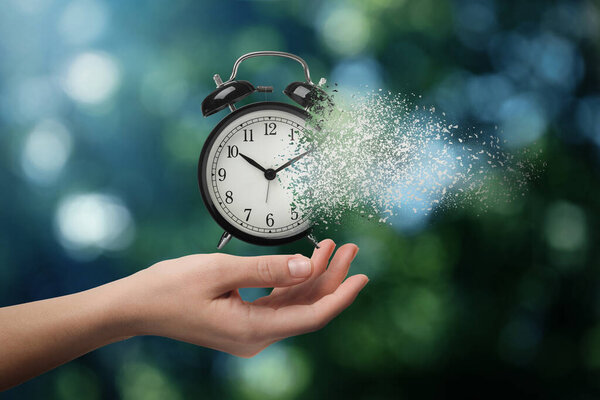 Time running out. Woman with dissolving alarm clock on blurred background, closeup