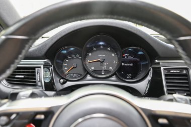 Speedometer and tachometer inside of modern car, closeup