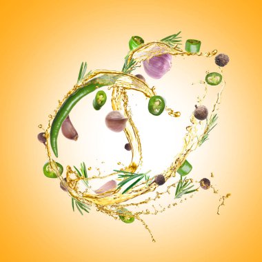 Altın arka planda kırmızı biber, biberiye, baharat ve sarımsak ile pişirme yağı sıçraması