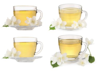 Fincanlarda lezzetli bitki çayı ve beyaz arka planda güzel çiçekler.