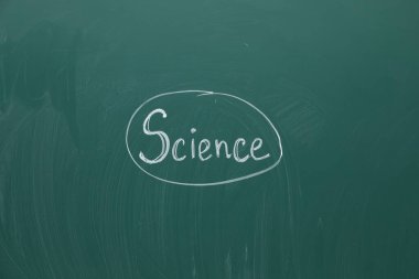 Word Science written with chalk on green board