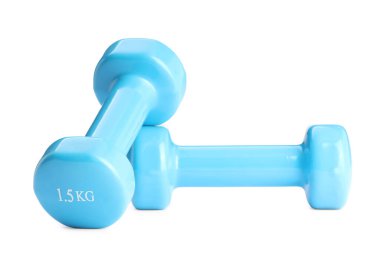Açık mavi halterler beyaza izole edilmiş. Spor malzemeleri.