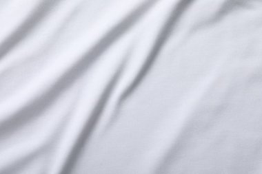 Arkaplan olarak beyaz kumaşın dokusu, üst görünüm