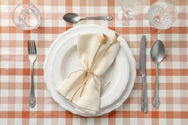 Stylish setting with cutlery and plates on table, flat lay